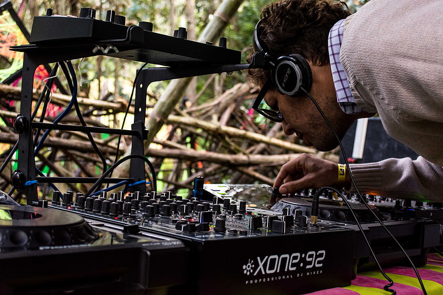 DJ Mixing Music on Xone:92 Mixer at Outdoor Festival