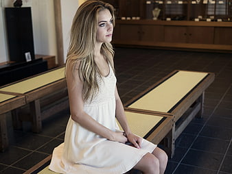 Woman in White Dress Sitting on Wooden Bench
