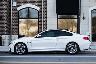 White BMW M4 Coupe Parked on City Street