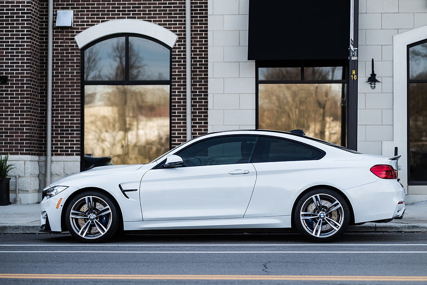 White BMW M4 Coupe Parked on City Street