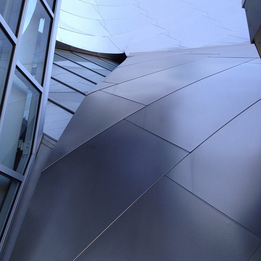 Modern Futuristic Architecture with Geometric Metal Panels