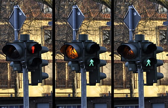 Triptych of Urban Pedestrian Traffic Signals Showing Red, Amber, and Green States