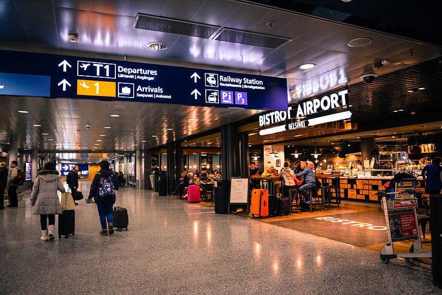 Helsinki Airport Terminal Interior with Bistro and Travelers