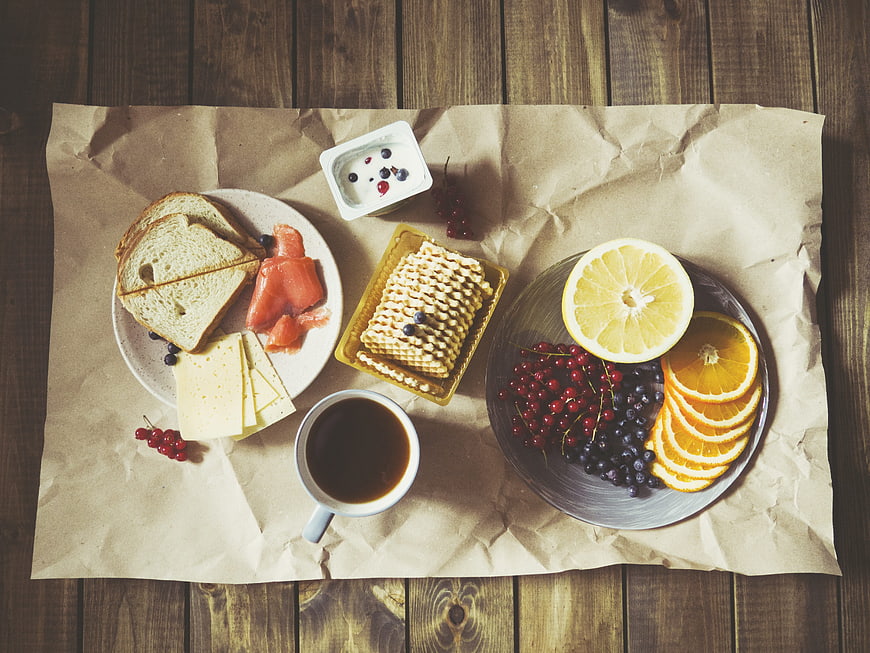 Healthy Breakfast Flat Lay With Coffee, Waffles, Salmon, Cheese, And Fresh Fruit