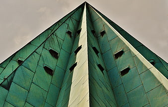 Low angle view of green pyramid skyscraper architecture