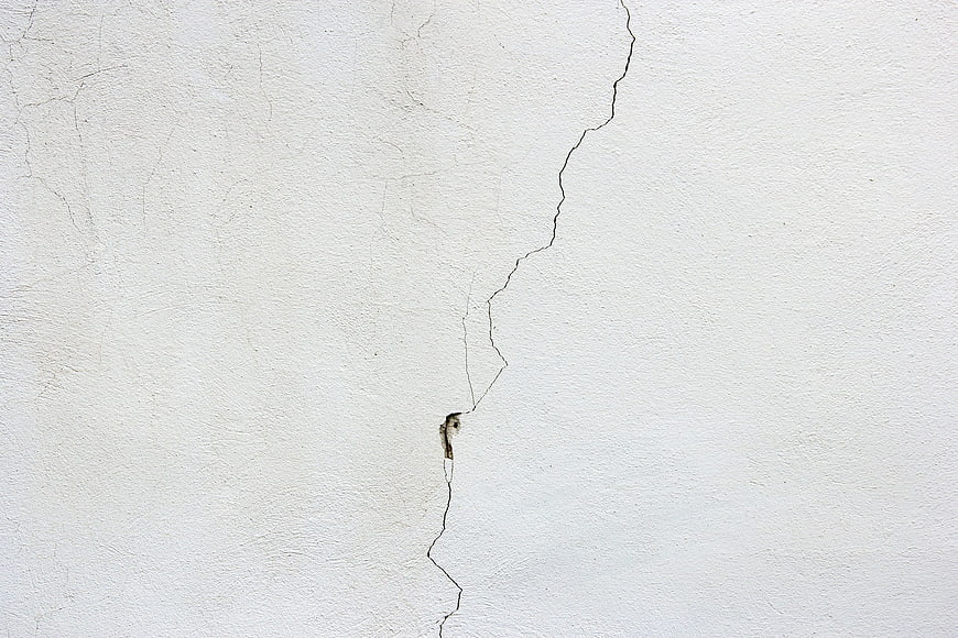Cracked White Plaster Wall Texture Background