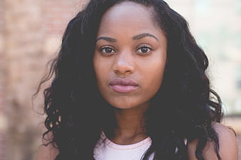 Portrait of a beautiful black woman with curly hair