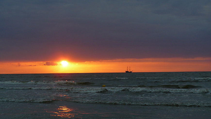 Sailboat Silhouette on Baltic Sea Sunset Horizon