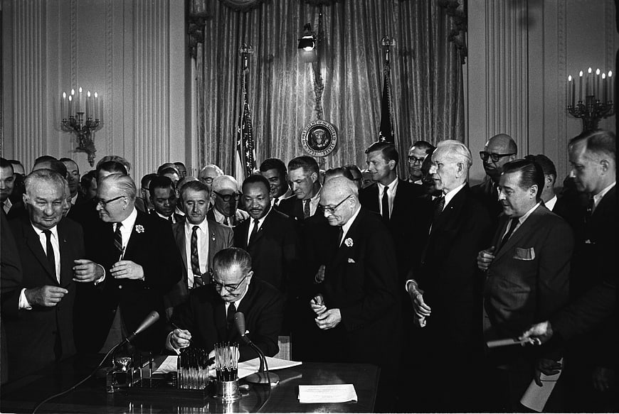 Historical Black and White Photo of Civil Rights Act Signing Ceremony