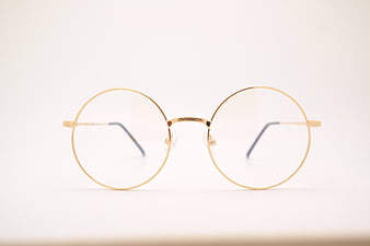 Gold Round Wire-Rimmed Glasses On White Background