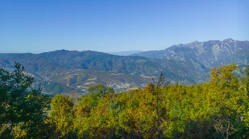 Scenic Mountain Landscape with Autumn Foliage and Blue Sky