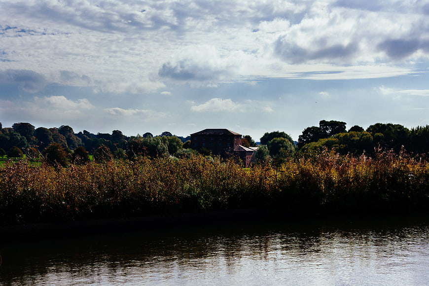 Riverside Landscape with House and Autumn Reeds
