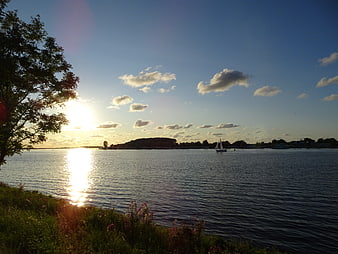 Sailboat on Lake at Sunset with Golden Hour Light