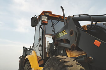 Low angle view of yellow construction wheel loader