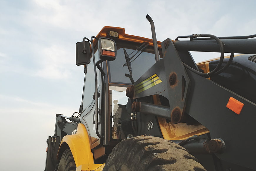 Low angle view of yellow construction wheel loader