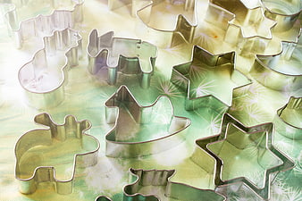 Metal Cookie Cutters on Green Patterned Background