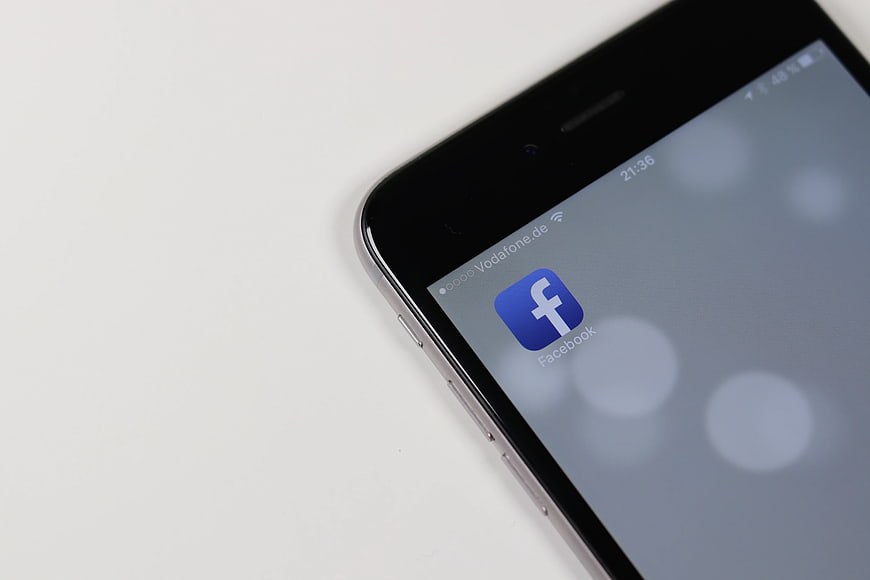 Close-up of Smartphone with Facebook App Icon on Screen