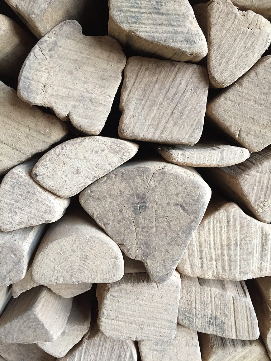 Close-up texture of stacked firewood logs