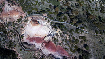 Aerial view of volcanic crater with wooden boardwalk