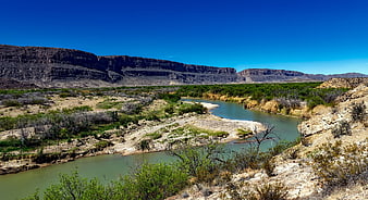 Winding River Through Desert Canyon Landscape