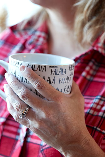 Woman Holding Festive Coffee Mug in Red Flannel