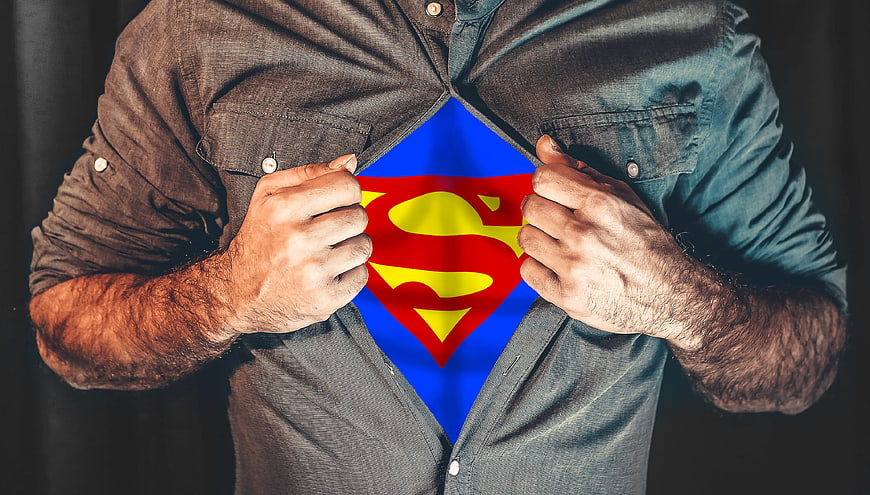 Man Revealing Superman Logo Under Shirt