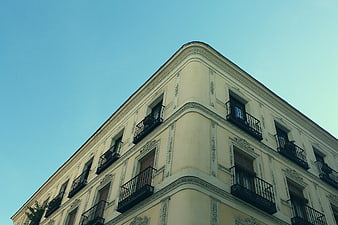 Low angle view of classic European building facade with balconies
