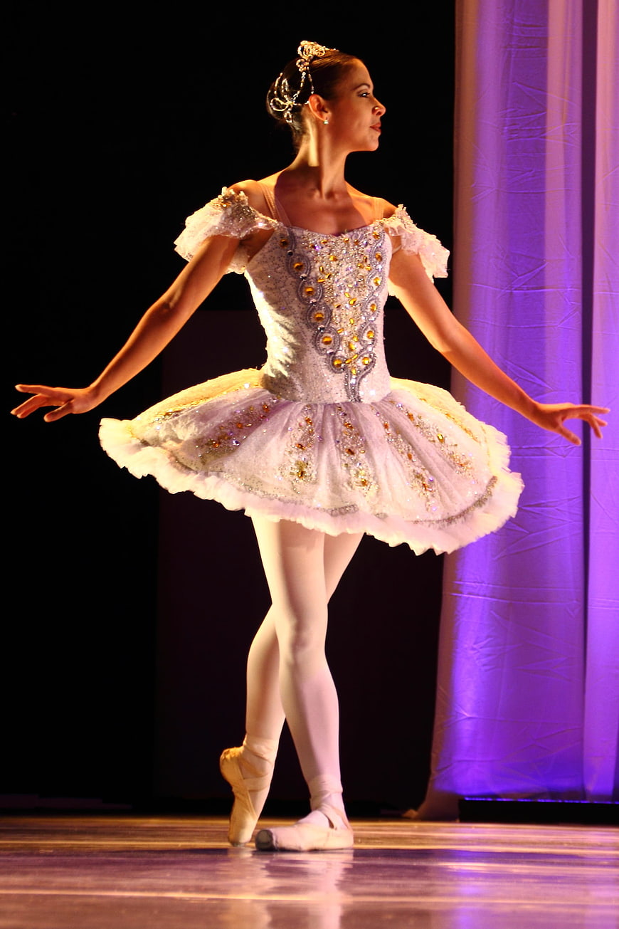 Ballerina in white tutu performing on stage