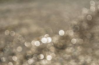 Abstract beige bokeh background with soft light circles