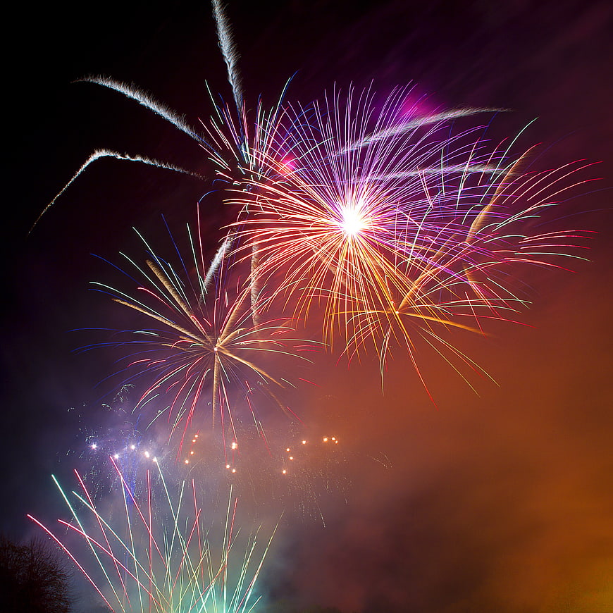 Colorful fireworks exploding in the night sky