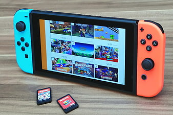 Nintendo Switch Console with Neon Joy-Cons and Game Cards