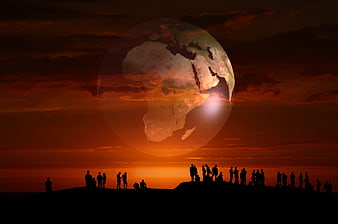 Silhouetted Crowd Watching Giant Earth Globe at Dramatic Sunset