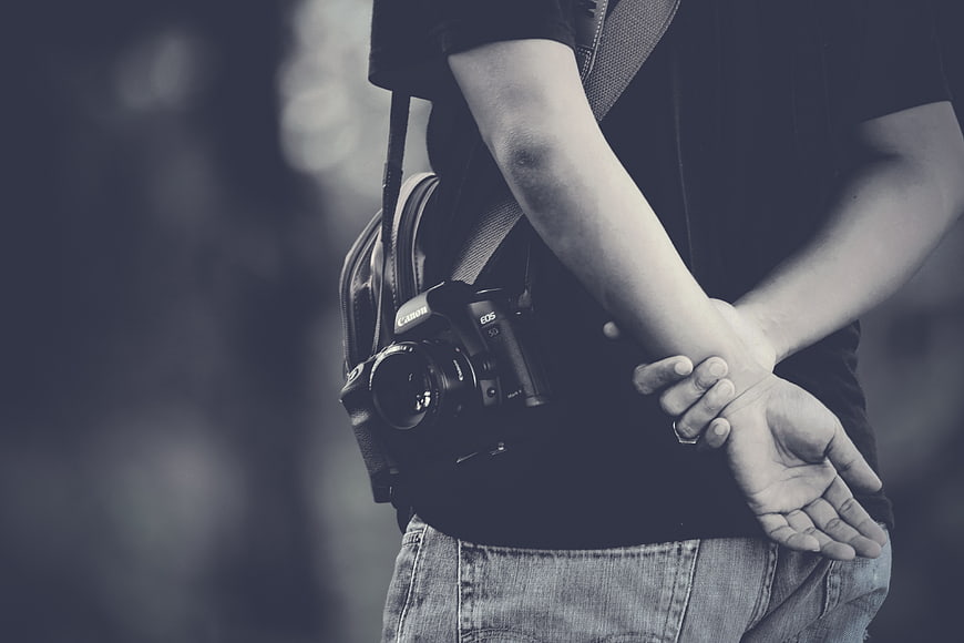 Photographer with Canon Camera and Bag