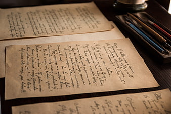 Vintage handwritten letters on aged paper with fountain pens