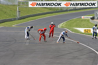Race Track Marshals Cleaning Asphalt at Red Bull Ring