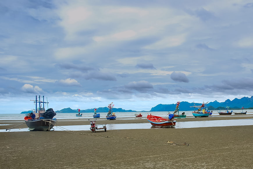 Colorful Fishing Boats on Sandy Beach at Low Tide