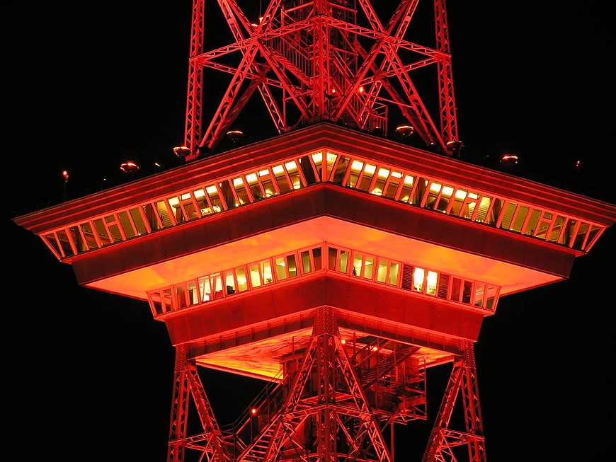 Red illuminated observation deck of Tokyo Tower at night