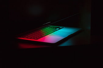 Laptop with RGB Keyboard in Dark Room