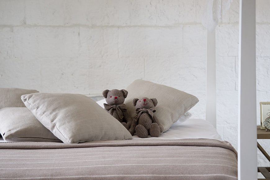 Cozy Bedroom with Teddy Bears and Neutral Linen Bedding