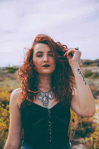 Redhead Woman with Silver Jewelry in Nature