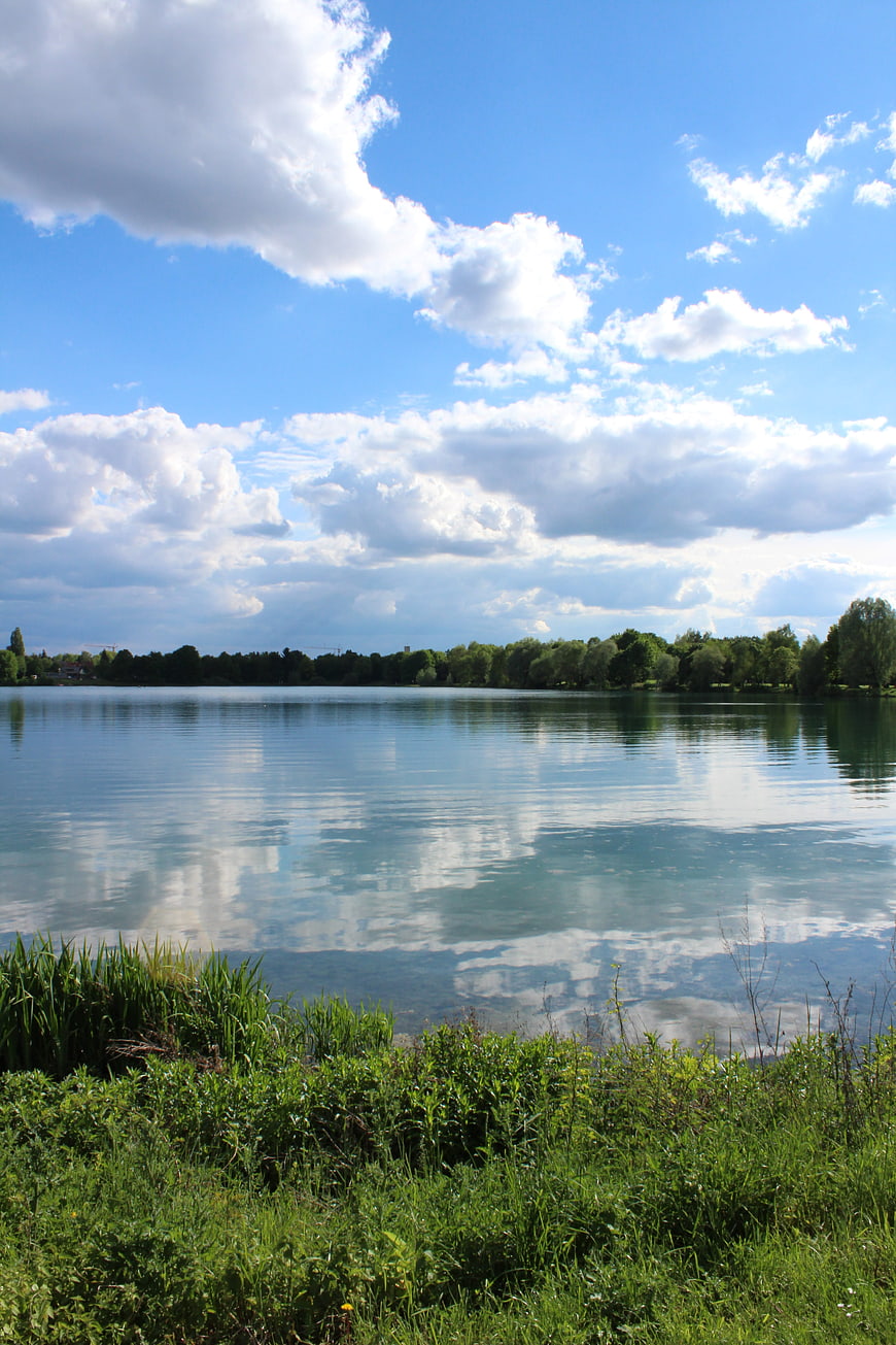 Serene Lake Landscape with Blue Sky and Cloud Reflections