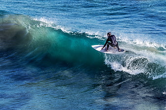 Surfer riding a wave in the ocean