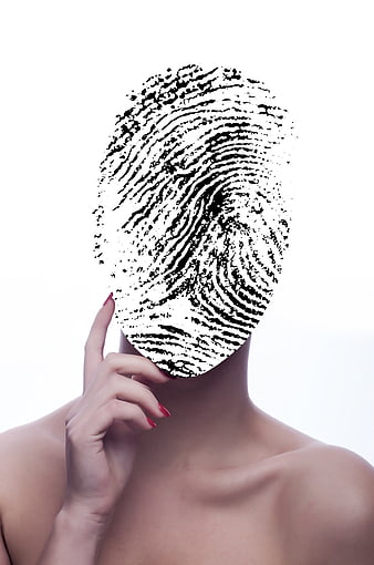 Conceptual woman with fingerprint face symbolizing identity and data security