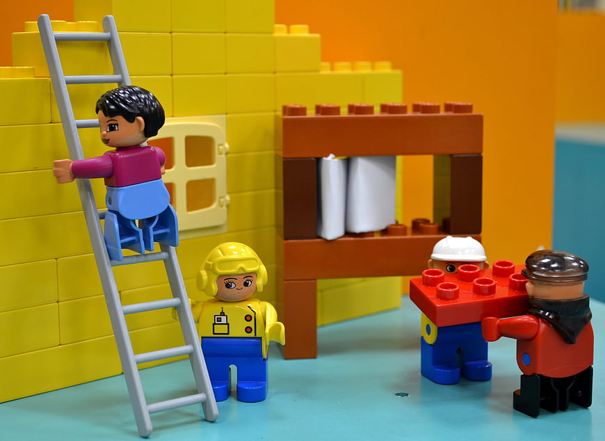 Colorful Duplo construction scene with toy figures and blocks