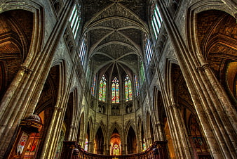 Gothic Cathedral Interior with Stained Glass Windows and Arches
