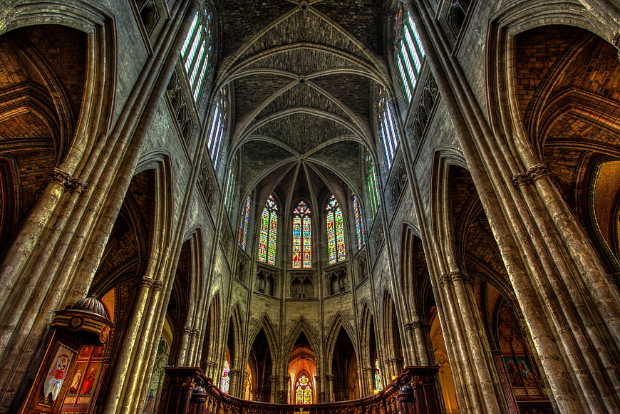 Gothic Cathedral Interior with Stained Glass Windows and Arches