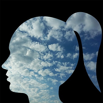 Double exposure woman profile silhouette filled with blue sky and clouds