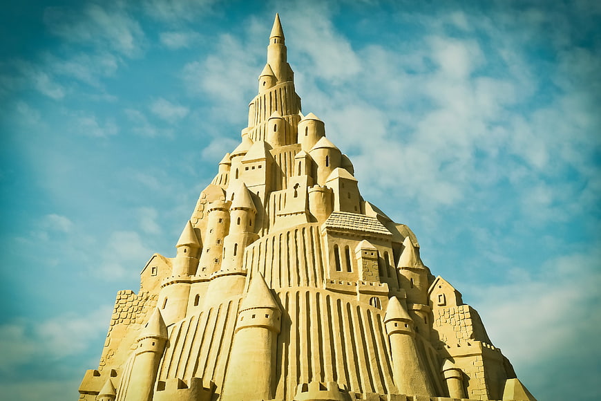 Intricate Sand Castle Sculpture Against Blue Sky