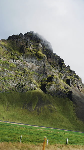 Misty Green Mountain Landscape with Road and Fog