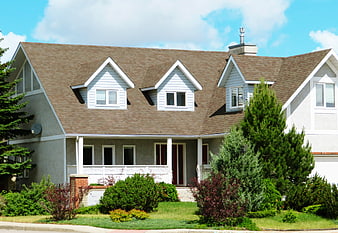 Suburban Home Exterior With Landscaped Front Yard And Dormer Windows